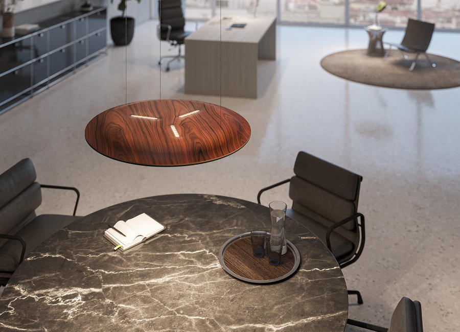 Die runde Pendelleuchte Lighting Pad Lounge von Nimbus hängt in einem Büro über einem runden Besprechungstisch. (Foto: DesignRaum GmbH/Nimbus)