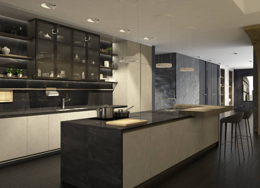 Eine edle, moderne Wohnküche mit einem Küchenblock in der Mitte, der von mehreren Pendelleuchten beleuchtet wird. Deckenstrahler sorgen für Licht an den Arbeitsplatten. (Foto: Christoph Kügler)
