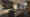 Rendering einer luxuriösen offenen Küche: Drei c.Space pendant Pendelleuchten hängen über der zentralen Kücheninsel, mehrere Downlights c.Flap beleuchten die hintere Wand mit Schränken und Spüle. (Foto: Christoph Kügler) imageThumbnailAlt