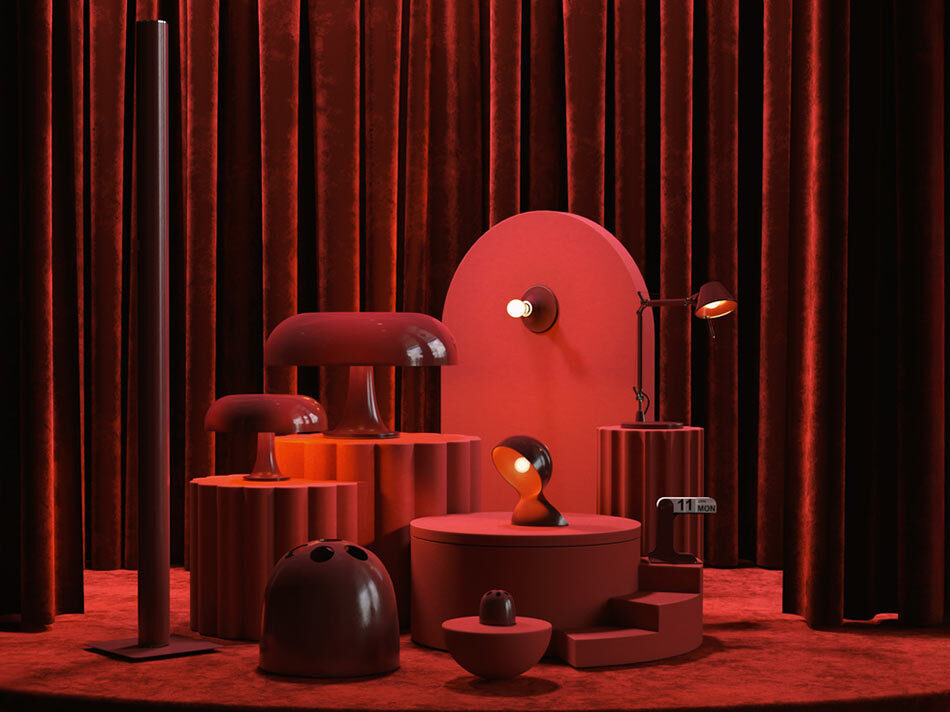 Inszenierung mehrerer roter Designleuchten der Artemide Ruby Red Collection auf unterschiedlich hohen roten Podesten vor einem dunkelroten Samtvorhang. Einige Leuchten sind eingeschaltet und setzen gezielte Lichtakzente. Die gesamte Szene ist in verschiedenen Rot- und Dunkelrottönen gestaltet und erinnert an eine Theaterbühne. Bild: Artemide – © Pezzo di Studio