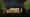 Ein Ferienhaus in Schleswig-Holstein bei Nacht: Die zweigeschossige Fensterfront erstreckt sich fast über die gesamte Breite des Hauses und ist hell erleuchtet, Wandleuchten links und rechts rahmen das Fenster ein. (Foto: Prediger Lichtberater) imageThumbnailAlt
