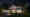 Eine luxuriöse Villa bei Nacht. In der Einfahrt steht ein Sportwagen, die Fassade wird durch Einbaudownlights punktuell beleuchtet. (Foto: Prediger Lichtberater) imageThumbnailAlt