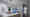 Eine offene Küche. Für die Allgemeinbeleuchtung sorgen p.011 Deckenstrahler (2er) von prediger.base, rechts setzen zwei Roxxane Fly Akku-Wandleuchten von Nimbus Akzente. (Foto: Prediger Lichtberater) imageThumbnailAlt
