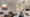 Das Wohnzimmer eines modernen Penthouses an der Alster in Hamburg: Die Deckenleuchte Skydro von Artemide sorgt für die Grundbeleuchtung, einzelne Deckenstrahler über Bilden setzen Lichtakzente. (Foto: Prediger Lichtberater) imageThumbnailAlt